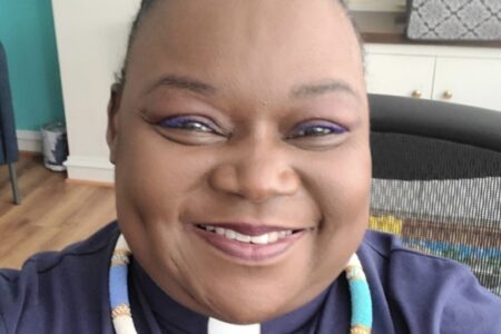 Headshot of Rev Cheni